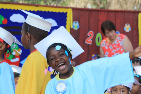 prek graduate smiling at ceremony