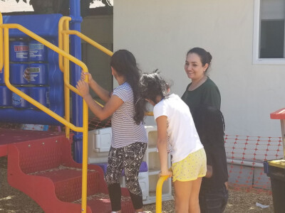 teachers watching school agers on the playground